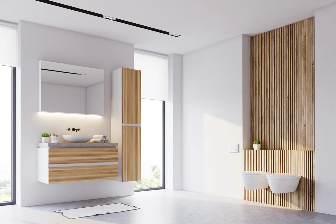 Salle de bain avec sol en béton ciré gris et éléments en bois